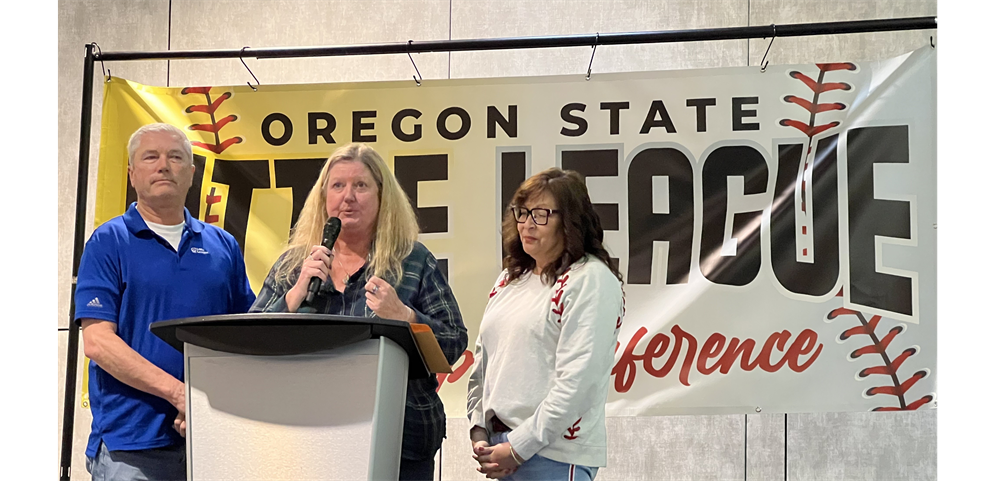 DA Leslie Parpart presenting the Oregon State LL Outstanding Service Award to Rick & Lydia Whitehead for HOSTING THE OREGON TEAMS AT San Bernardino for more than 19 years
