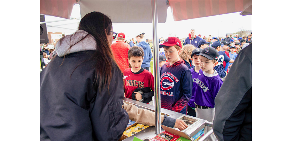 Christ Church serves up slush to players at the opening day festivities