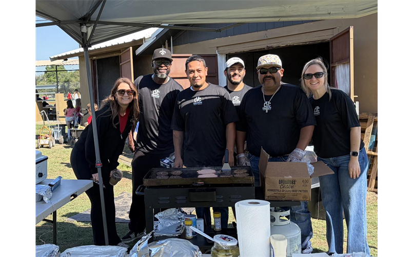 CYC Board Members making burgers at the Tee Ball Tournament 